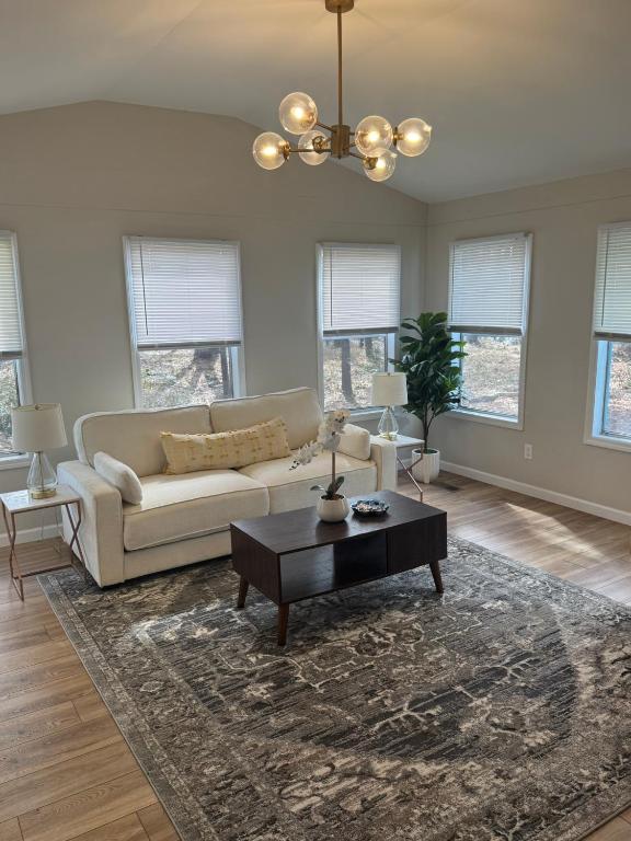 a living room with a couch and a table at Flossies in Seabrook