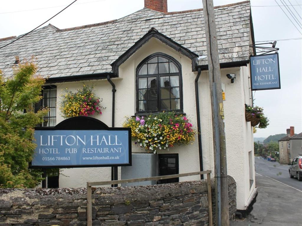 a building with a sign in front of it at Lifton Hall in Lifton