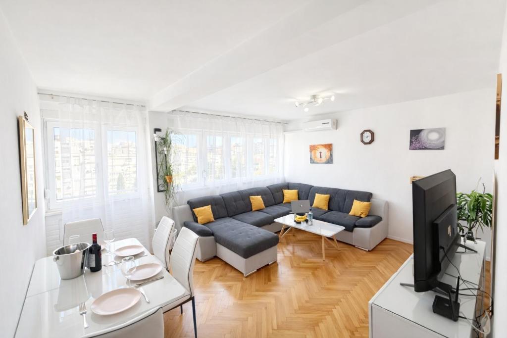 a living room with a couch and a table at Diocles Place in Split