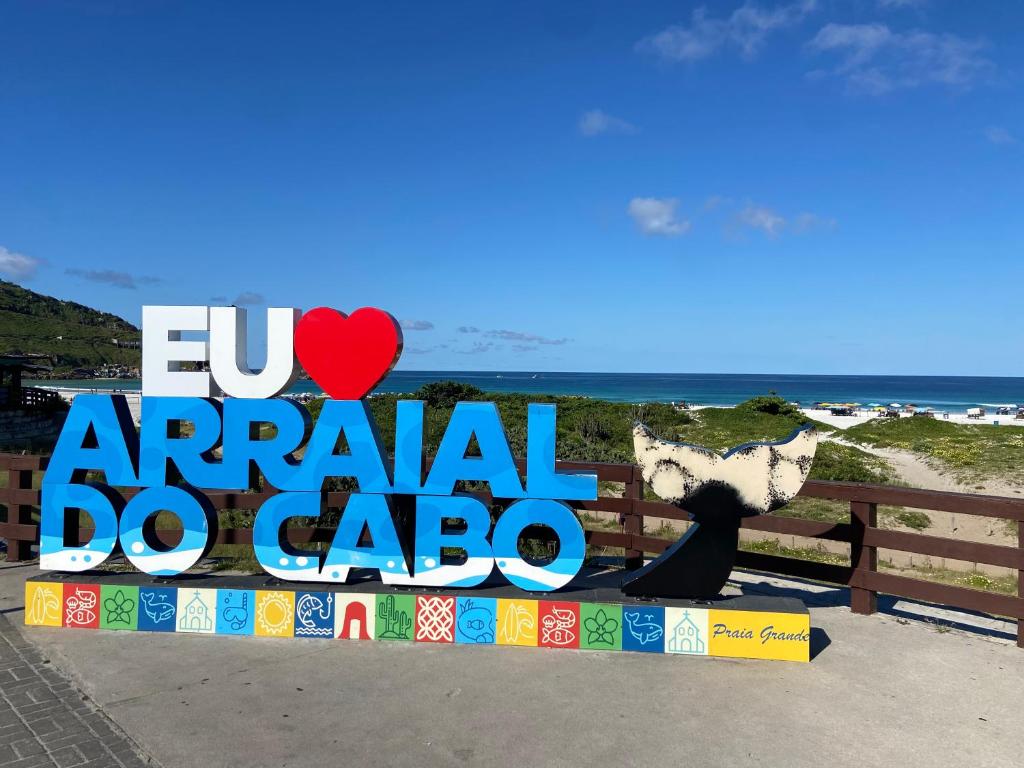 a sign for an annual do cabo event at the beach at Casa da Sol in Arraial do Cabo