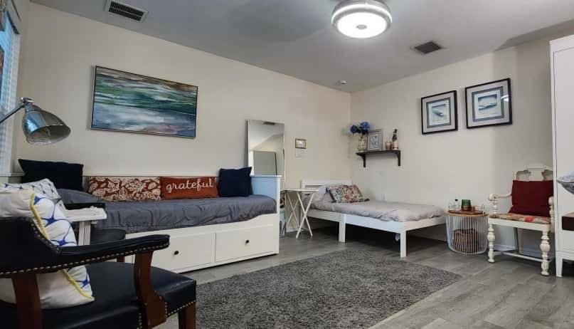 a living room with a couch and a table at Suit with Kitchen & Bath in Cocoa