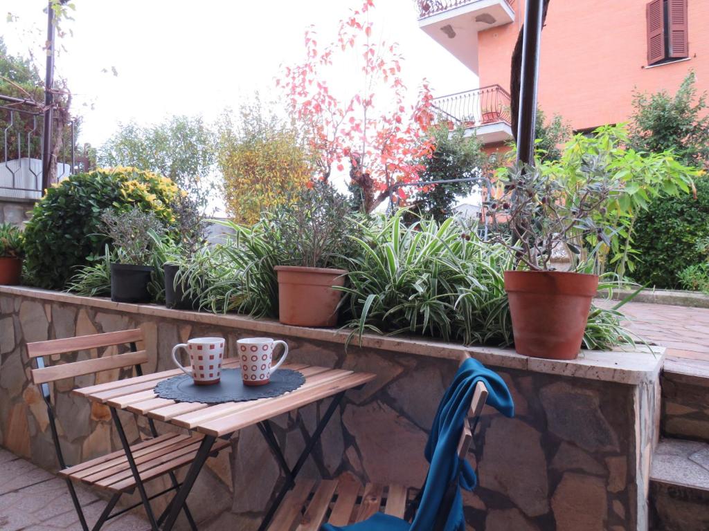 a small table with two cups on a patio at Civico 55 in Casale Torre San Giovanni