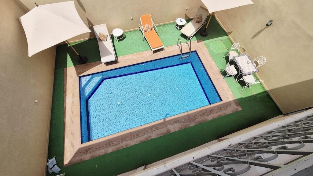 an overhead view of a swimming pool in a house at Modern Design Villa Private Pool Marrakech in Marrakesh