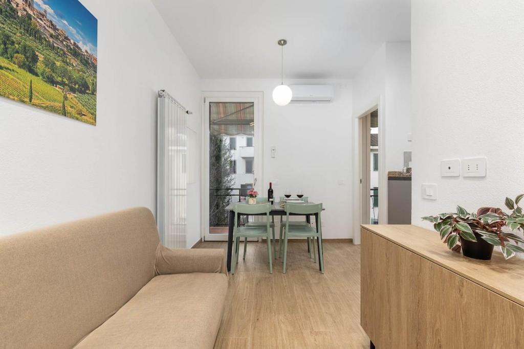 a living room with a couch and a table at House Tuscany in Poggibonsi