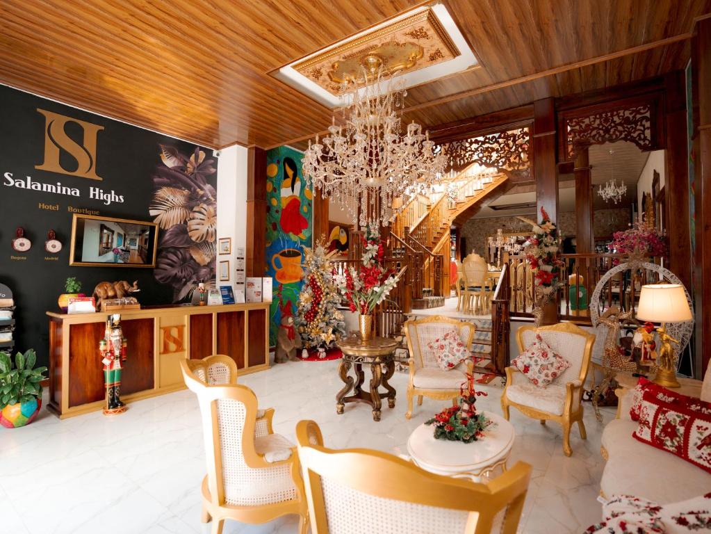 a store with a table and chairs and a chandelier at Salamina Highs in Salamina