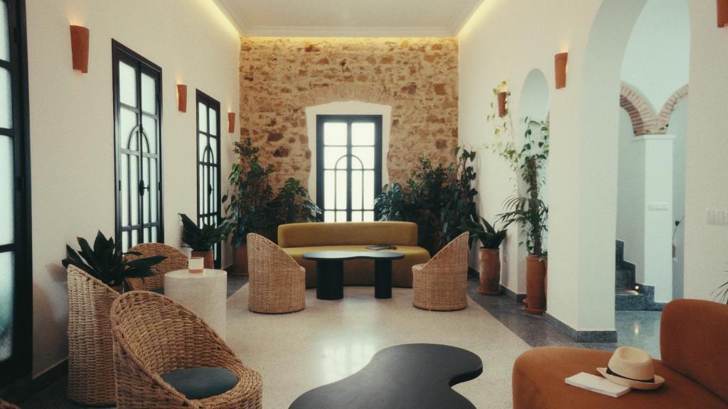 a lobby with chairs and a table in a building at Nbta House in Tangier