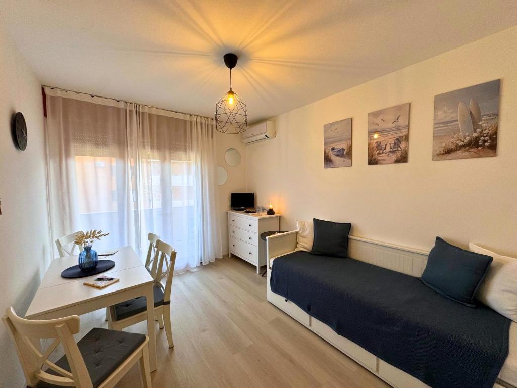 a bedroom with a bed and a table and a desk at Villa Manuela in Grado