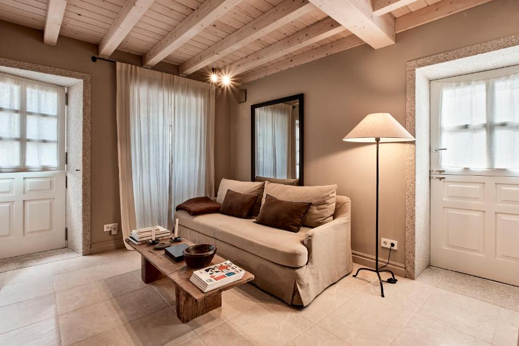 a living room with a couch and a table at Casa Juanita in Melide