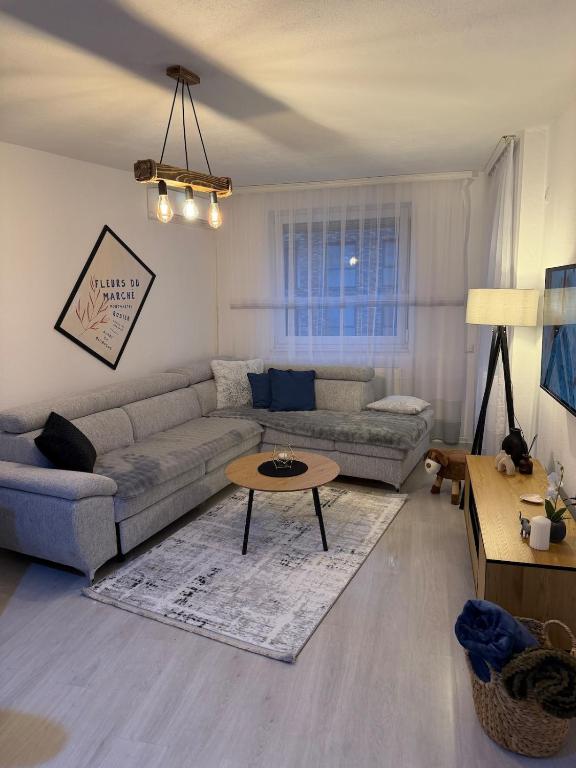 a living room with a couch and a coffee table at Molly Nest in Gjakove