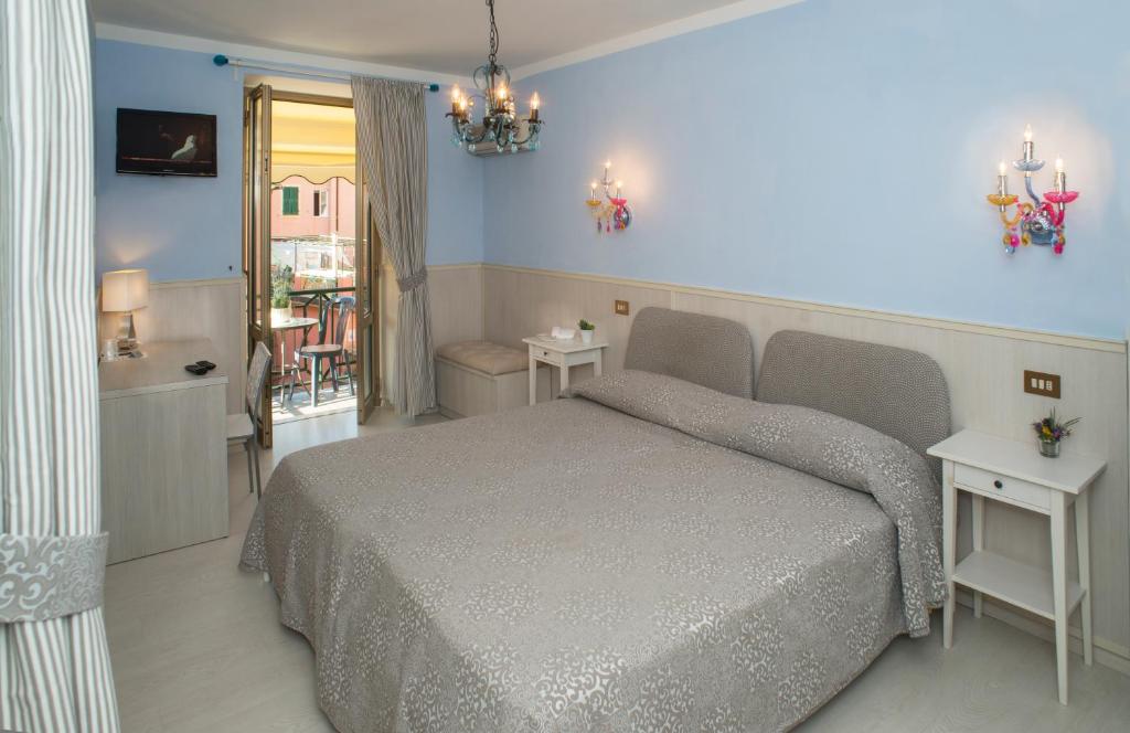 Postel nebo postele na pokoji v ubytování Stella Della Marina