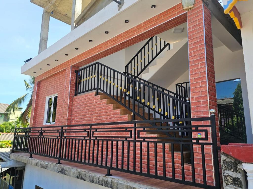 a staircase on a house with a brick wall at Risha villa in Trincomalee