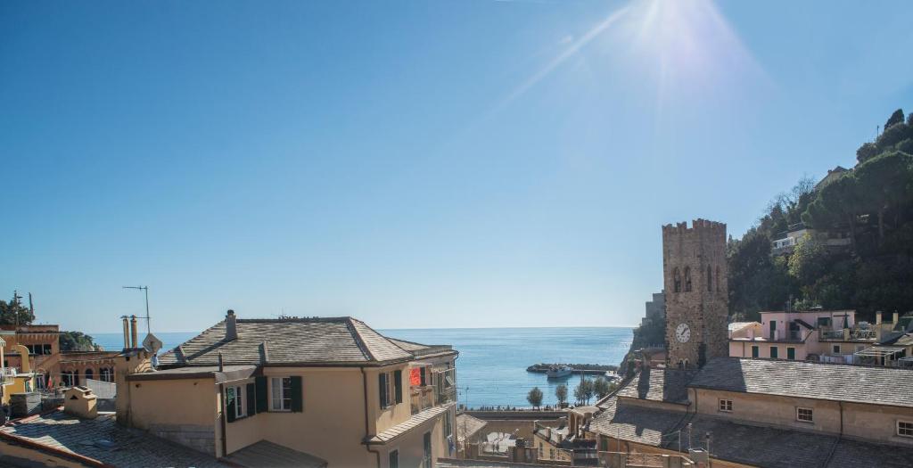 a view of a town with the ocean in the background at Stella Della Marina in Monterosso al Mare