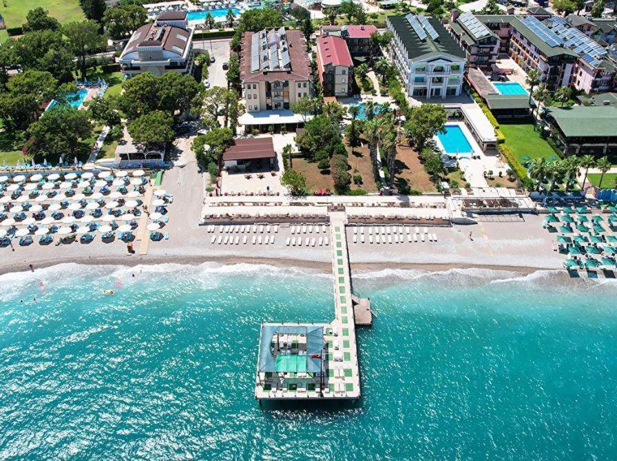 an aerial view of a beach with a boat in the water at ESMA CLOVE RESORT&SPa in Eskiömerler
