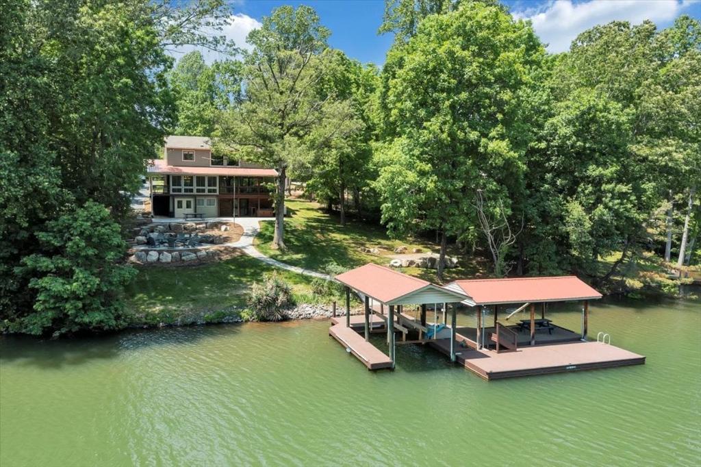 an aerial view of a house with a dock in the water at Emerald Shores - Lakefront, Private Dock & Fire Pit in Moneta