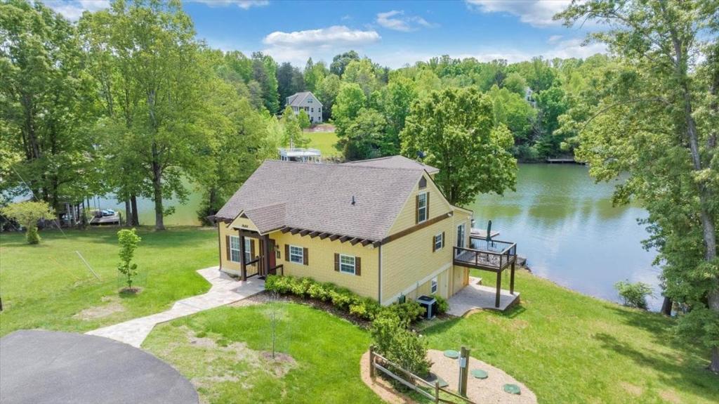 an aerial view of a house with a lake at Cape Cottage - Private dock & Fire Pit in Moneta