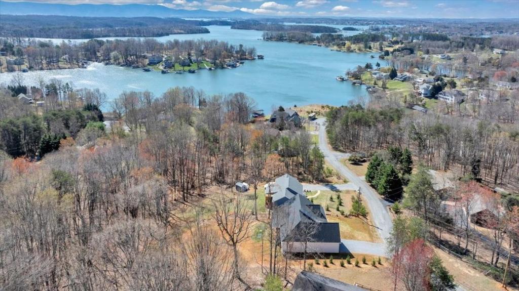 an aerial view of a house and a lake at Lake Twin Cove - New! in Moneta