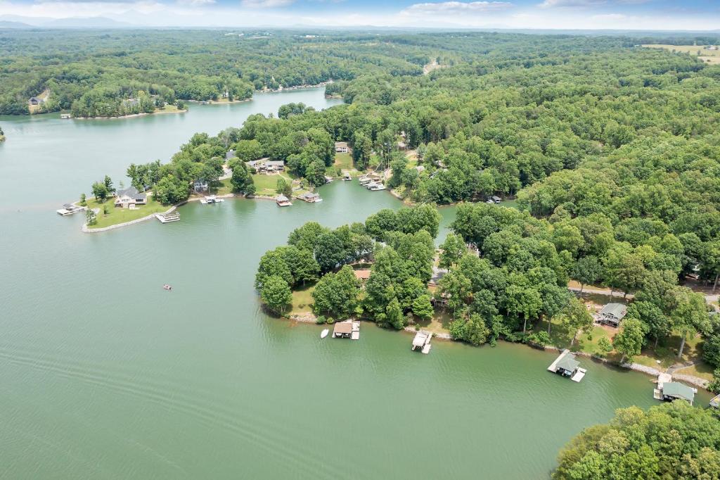an aerial view of a lake with houses and trees at Sundance - Lakefront w/ Private Dock in Moneta