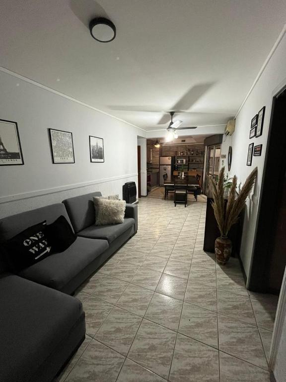 a living room with a couch and a table at Peatonal Santafesina in Santa Fe