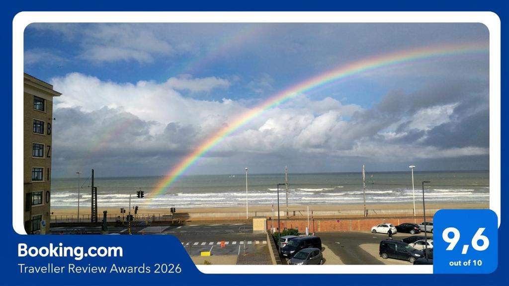 a rainbow in the sky over the beach at Splendid Seaview - Ostend Luxury Studio 4 persons at beach and sea in Ostend