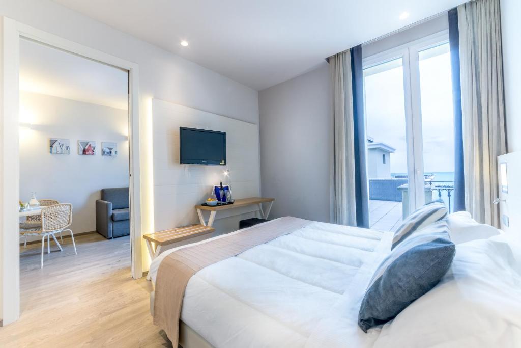 Postel nebo postele na pokoji v ubytování Hotel Agostini