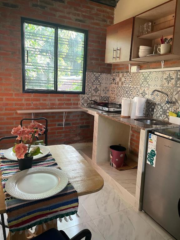 a kitchen with a table with a plate on it at Departamento en Lambare in Asunción