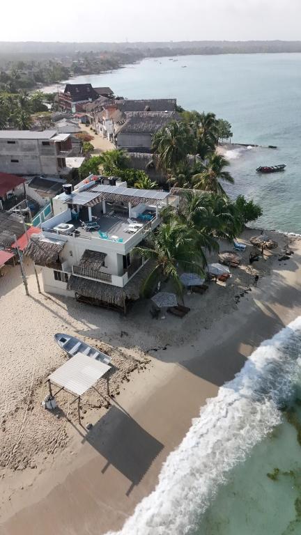 an aerial view of a house on the beach at Hotel Casa Sattva- Bed & Breakfast in Rincón
