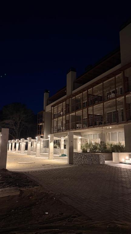a large building at night with its lights on at Almarena La Reserva UF 112 in Costa del Este