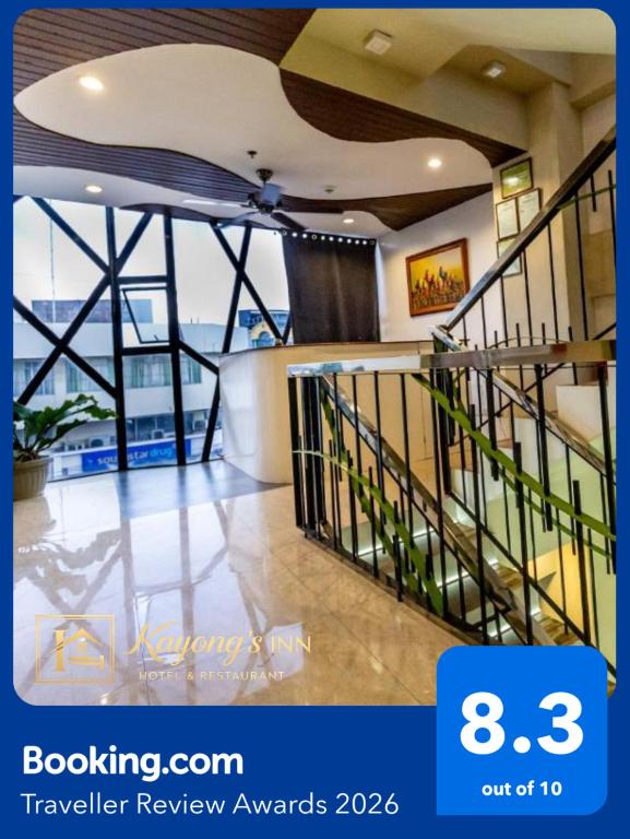 a view of a lobby with stairs in a building at Kayong's Inn in Dumaguete