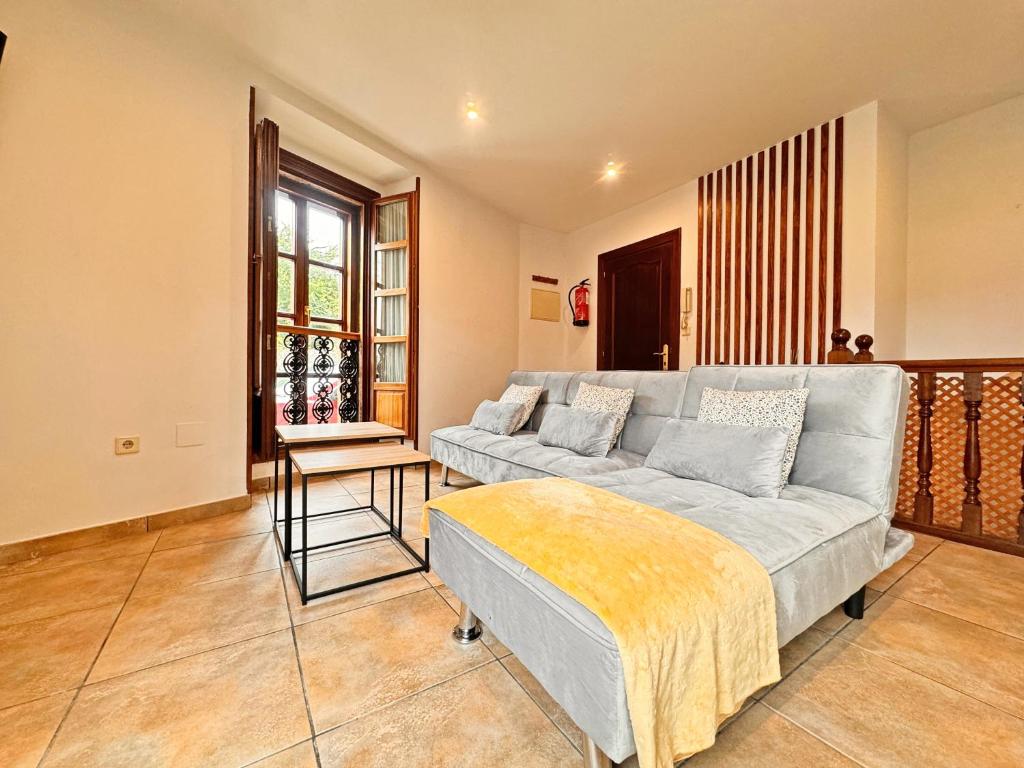 a living room with a couch and a table at Apartamentos Rurales LLeguera in Llanes