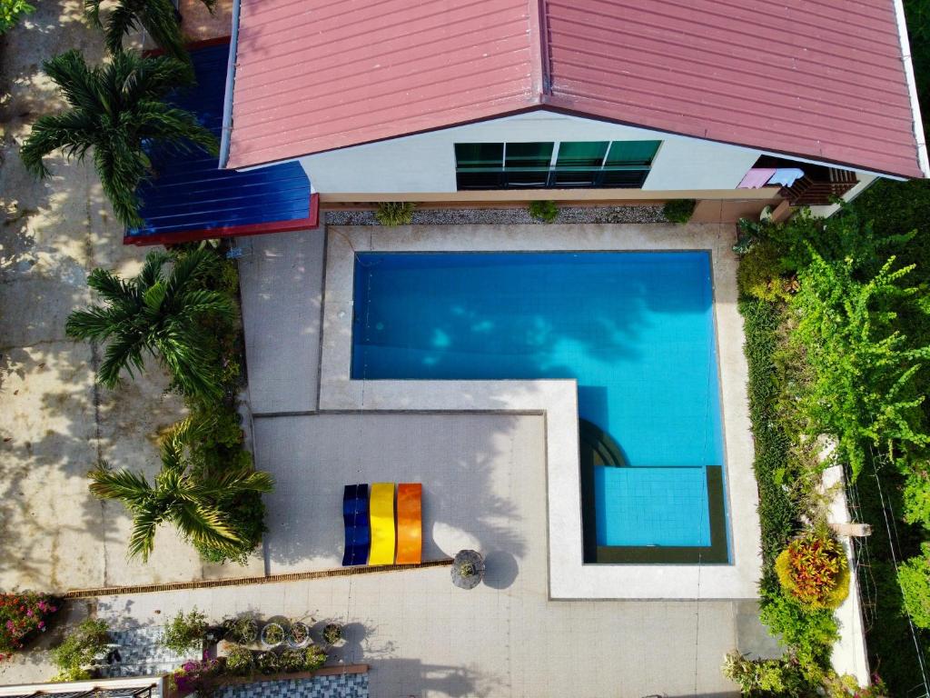 an overhead view of a swimming pool in a house at Blue Villa - Entire House with Private Pool in Panglao Island