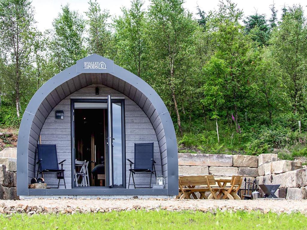 a small shed with chairs and a table and a table at Swallow - Uk51347 in Draughton