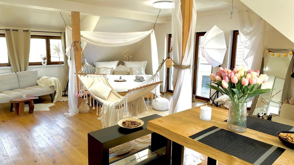 a living room with a hammock in a living room at STUDIO KRÁLOVICE Apartment in Prague
