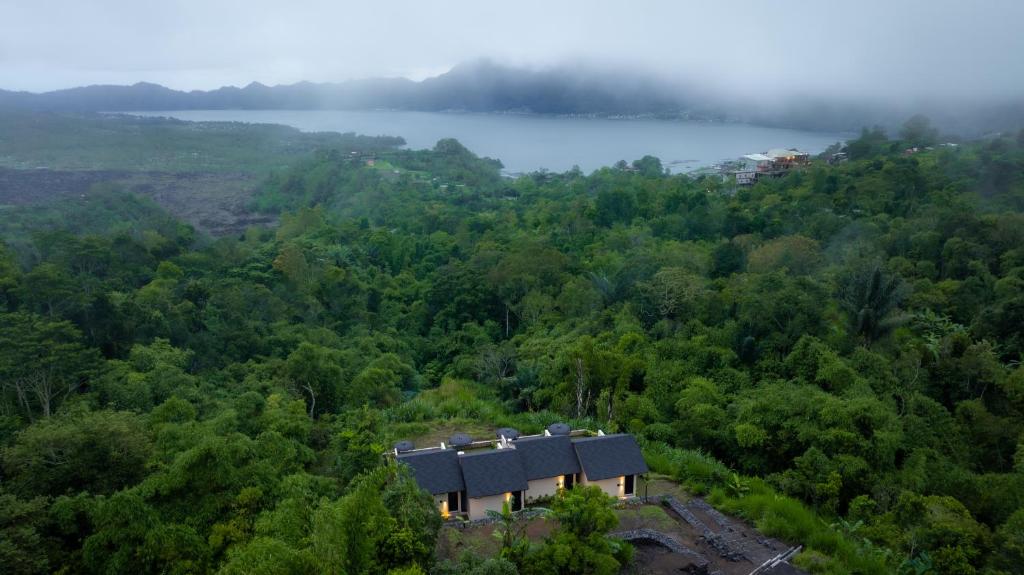 an aerial view of a house in the middle of a forest at Mount Valley Inn in Kubupenlokan