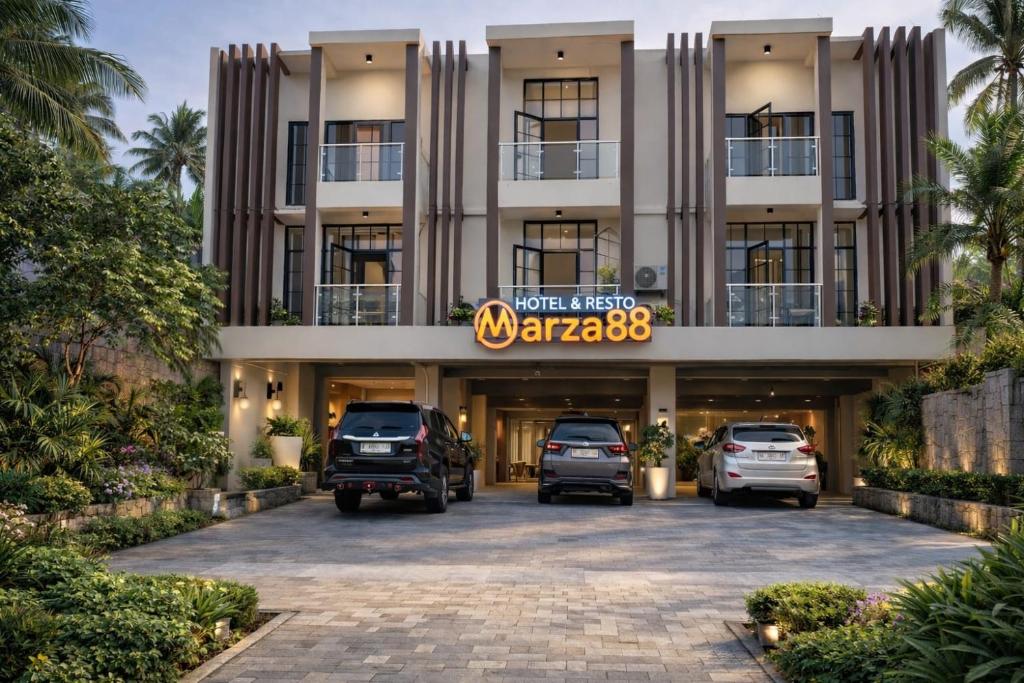 a parking lot in front of a hotel at Hotel & Resto Marza 88 in Pangkajene