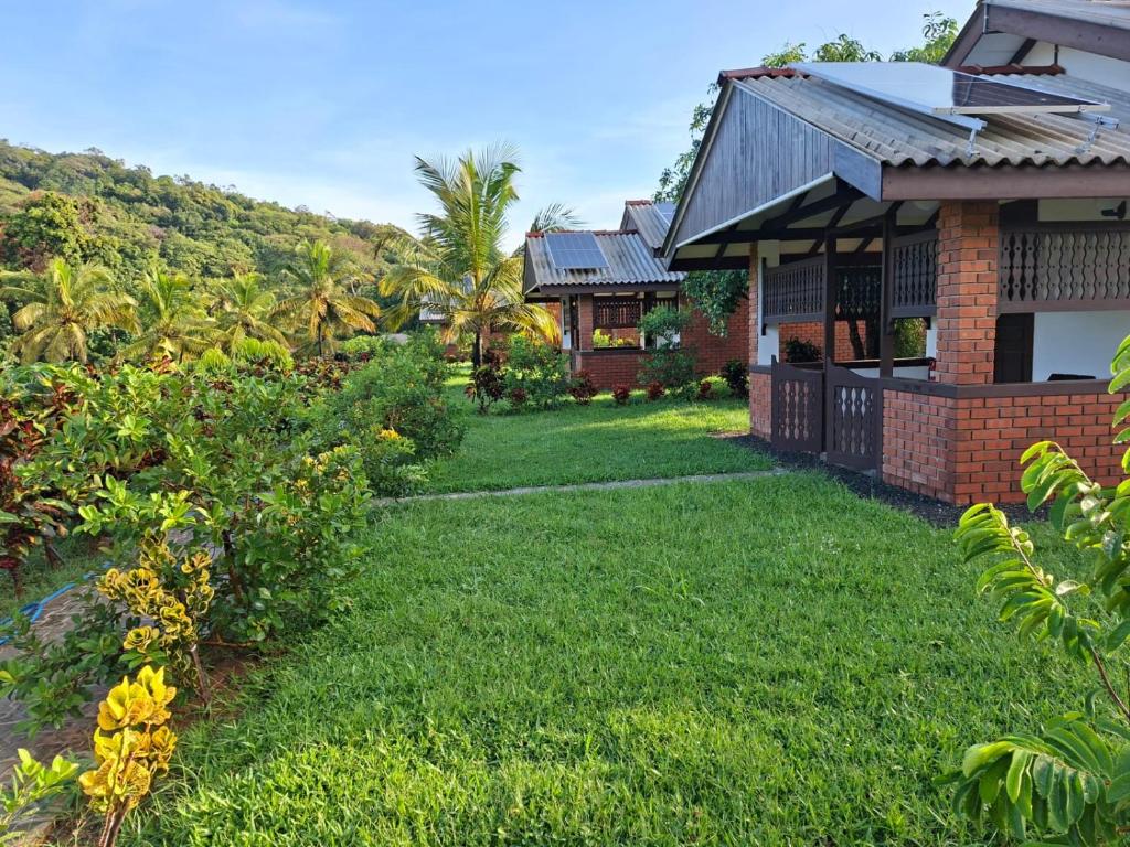 a yard in front of a house at Karanda Eco Resort in Dambulla