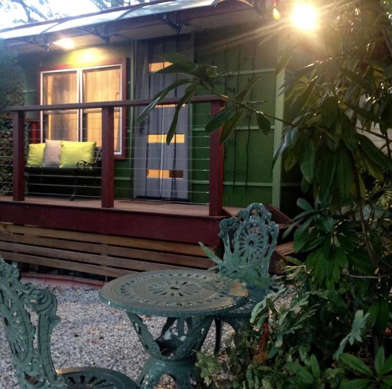 a table and chairs in front of a house at Dees Front Studio Room in Hazelbrook
