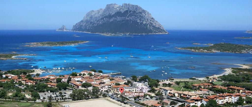 an aerial view of a small island in the ocean at Guesthouse La Locanda - Comfy Rooms & Local Food in Porto San Paolo