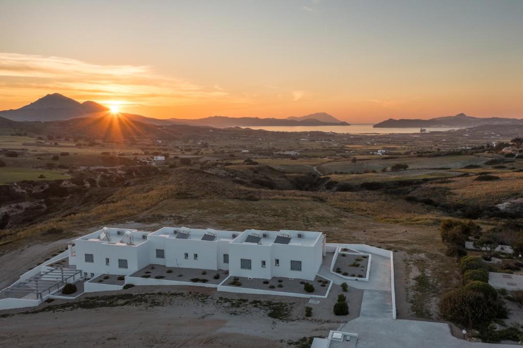 an aerial view of a house with the sunset in the background at Sunset Village 1 in Paleochori