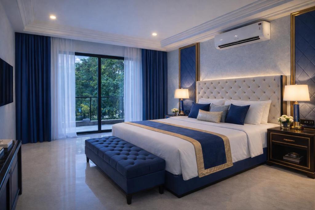 a large bedroom with a large bed and a window at Travellers Story Baga GOA in Baga