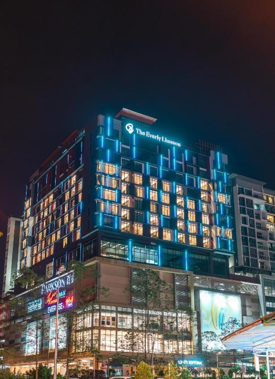 a building with blue lights on top of it at The Everly Lhesson Kuching in Kuching