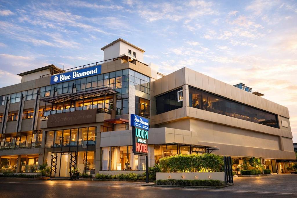 a large building with a sign in front of it at Blue Diamond Residency in Perintalmanna