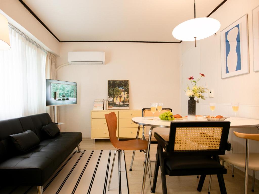 a living room with a couch and a table at Atelier7419 Songpa in Seoul