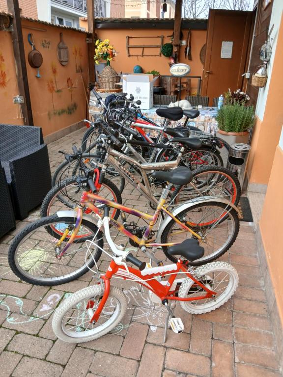 a row of bikes parked next to each other at Maruffi 17 zona clinica bilocali in Piacenza
