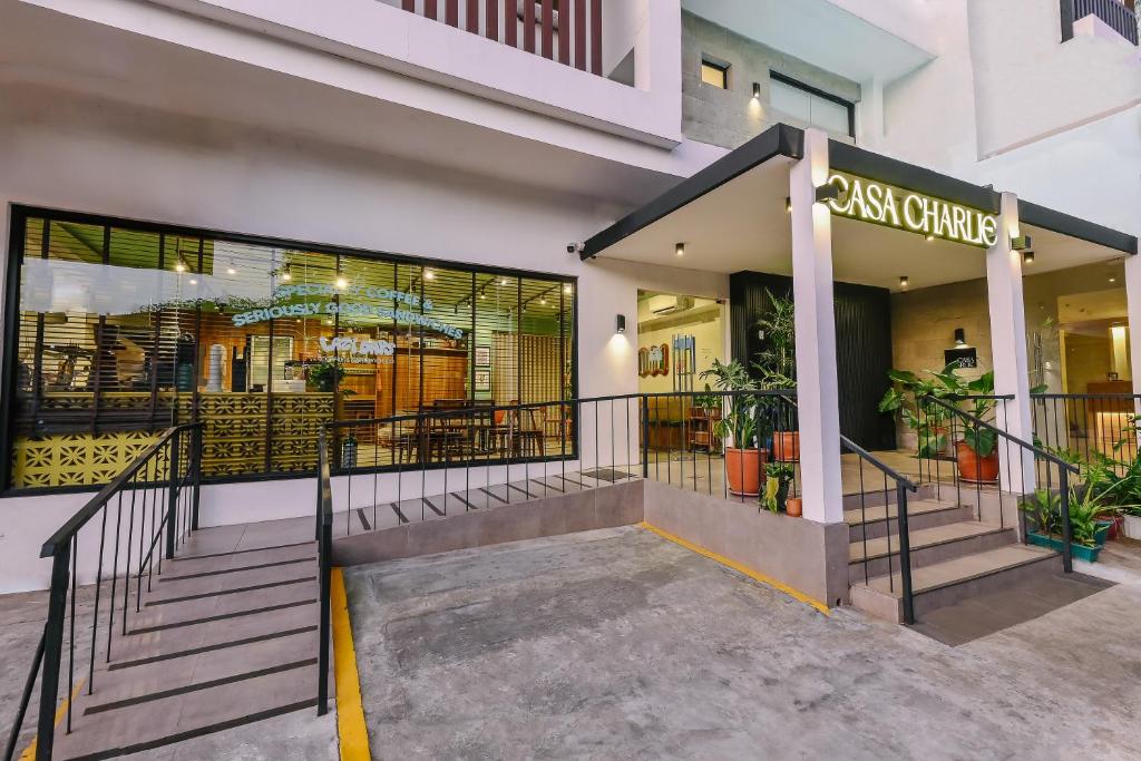 a store front of a building with a restaurant at Casa Charlie Hotel in Manila