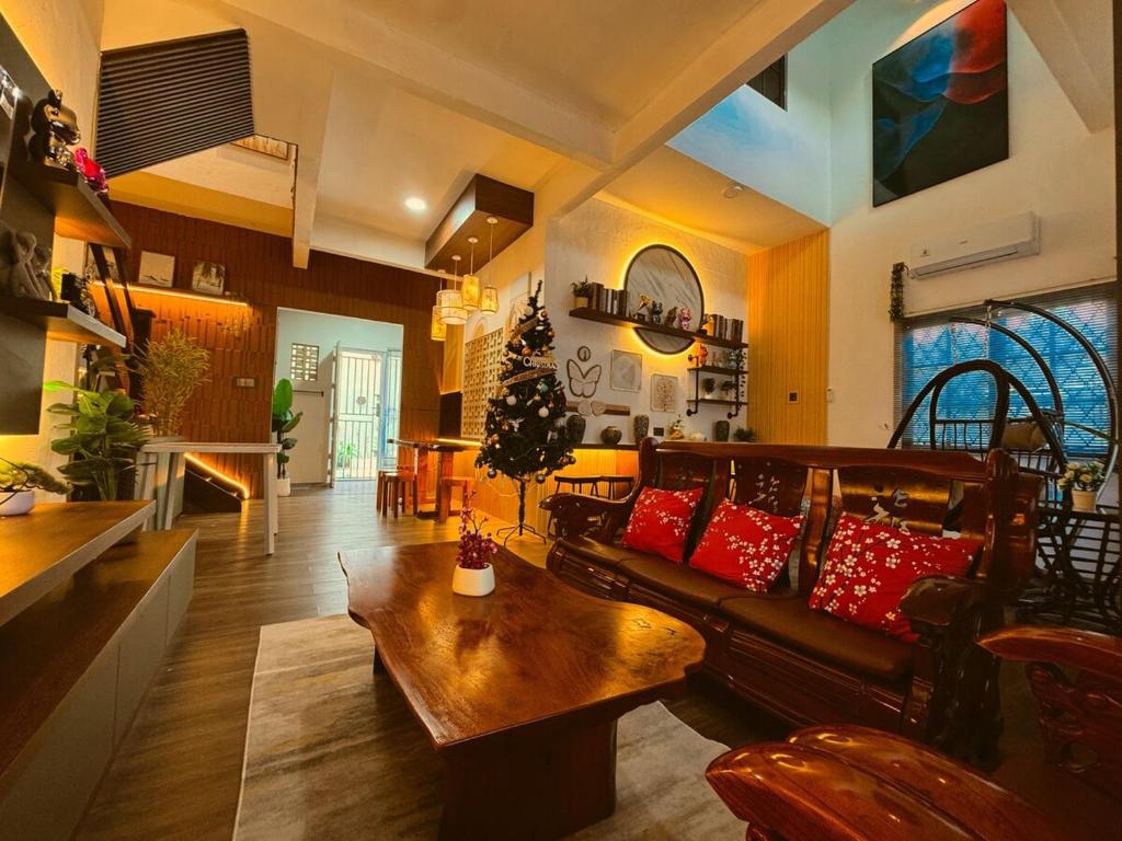 a living room with a couch and a table at Yokohama Premium House in Batam Center