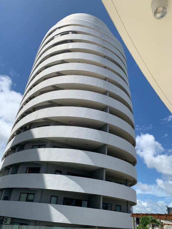 a white apartment building against a blue sky at Sky Garden Appartement in Quatre Bornes