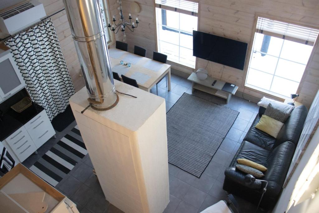 an aerial view of a living room with a couch and a table at Koliwood A in Kolinkylä