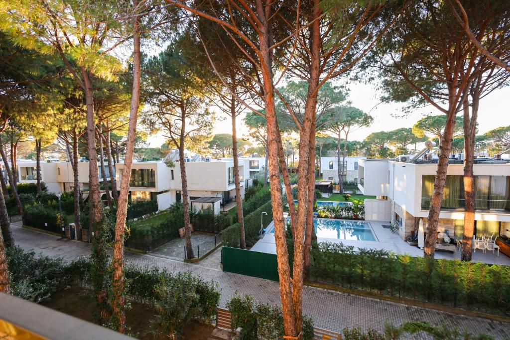 an aerial view of a resort with trees at SanPietro Apartments in Draç