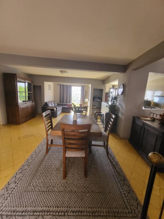 a living room with a wooden table and chairs at Mirador de San Miguel in San Miguel de Allende