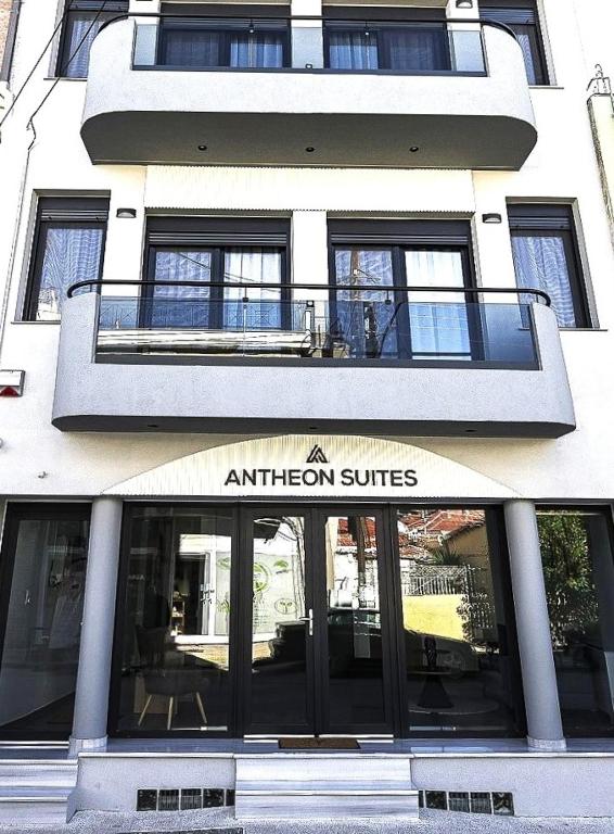 a white building with an entrance to an apartment suites at Antheon Suites Volos in Volos